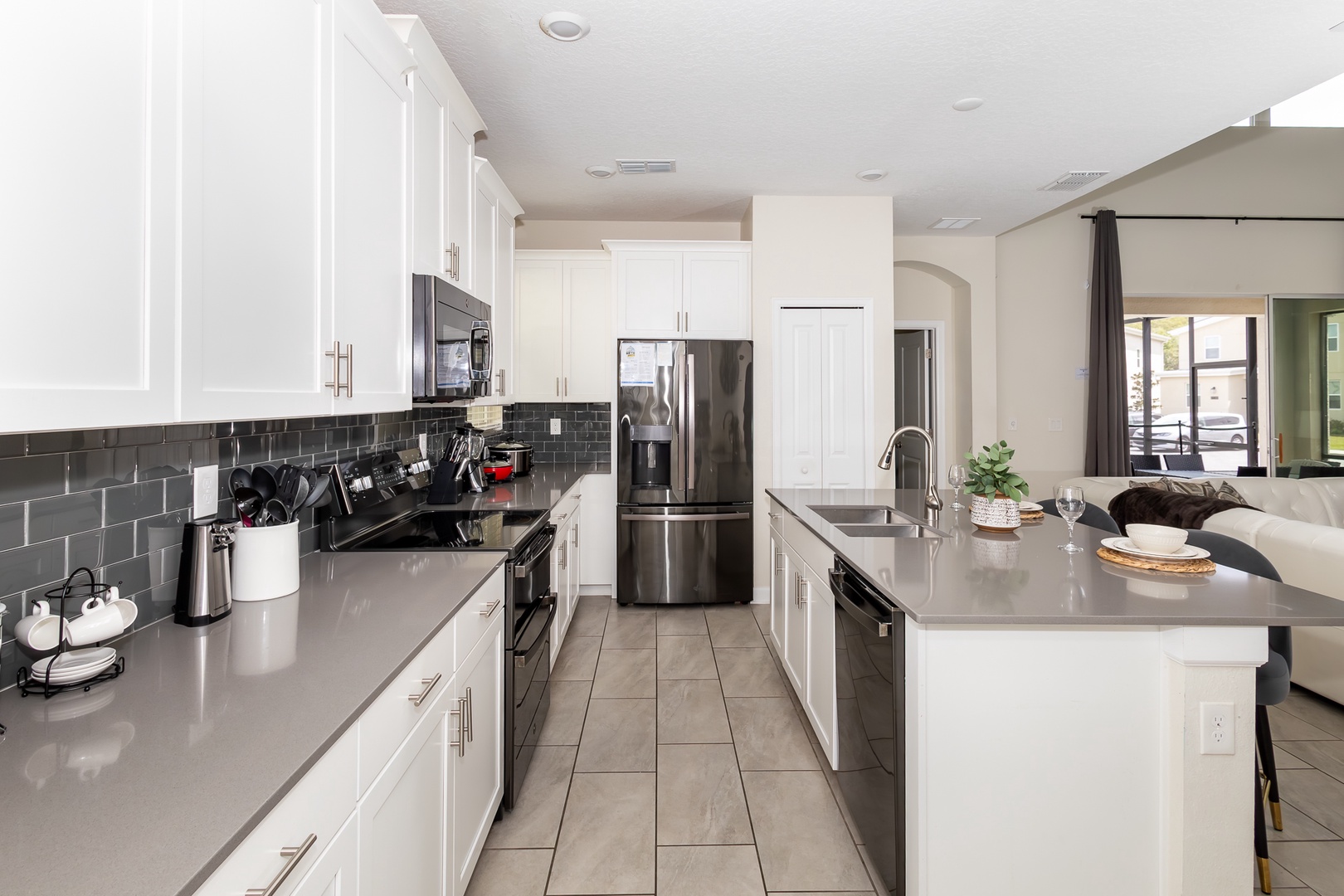 The open, airy kitchen offers ample space & all the comforts of home