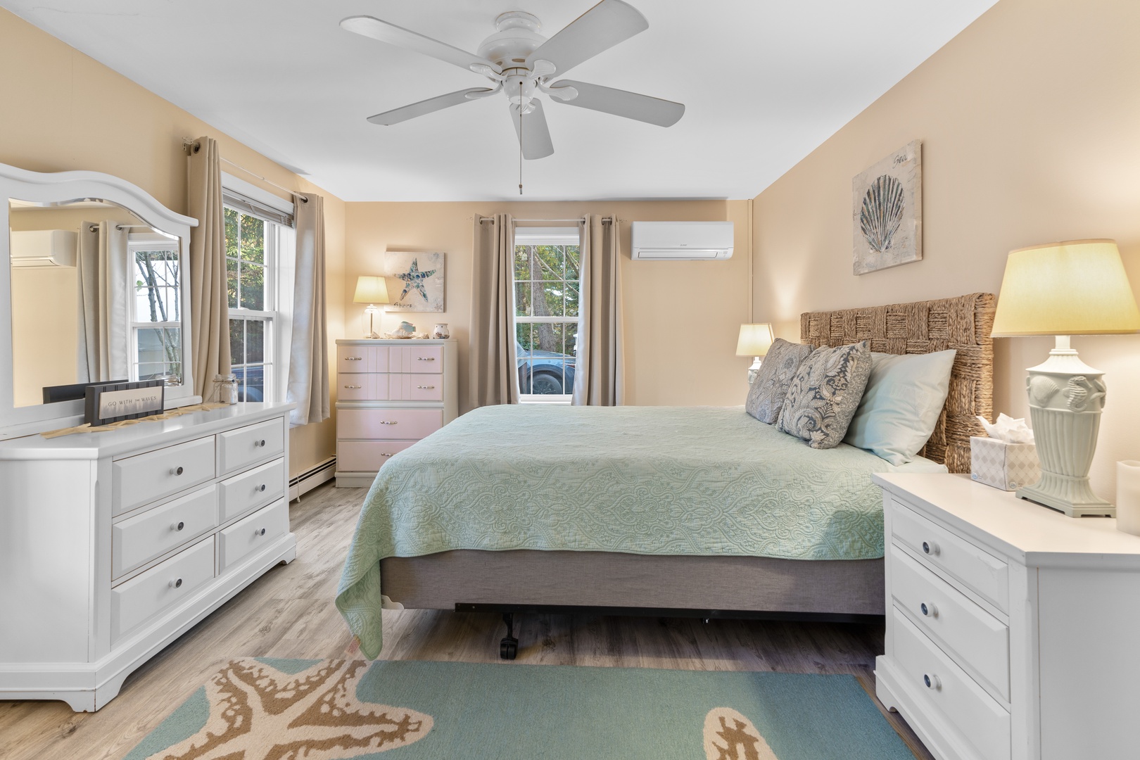 This 2nd floor bedroom offers a queen bed, desk workspace, & ceiling fan