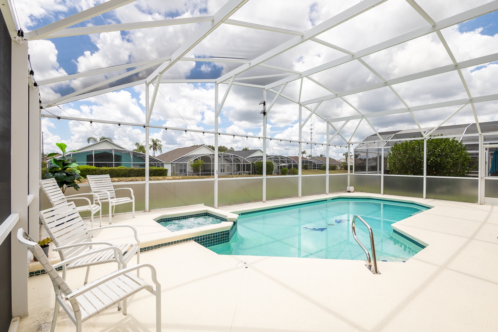 Screened in private pool with out door seating