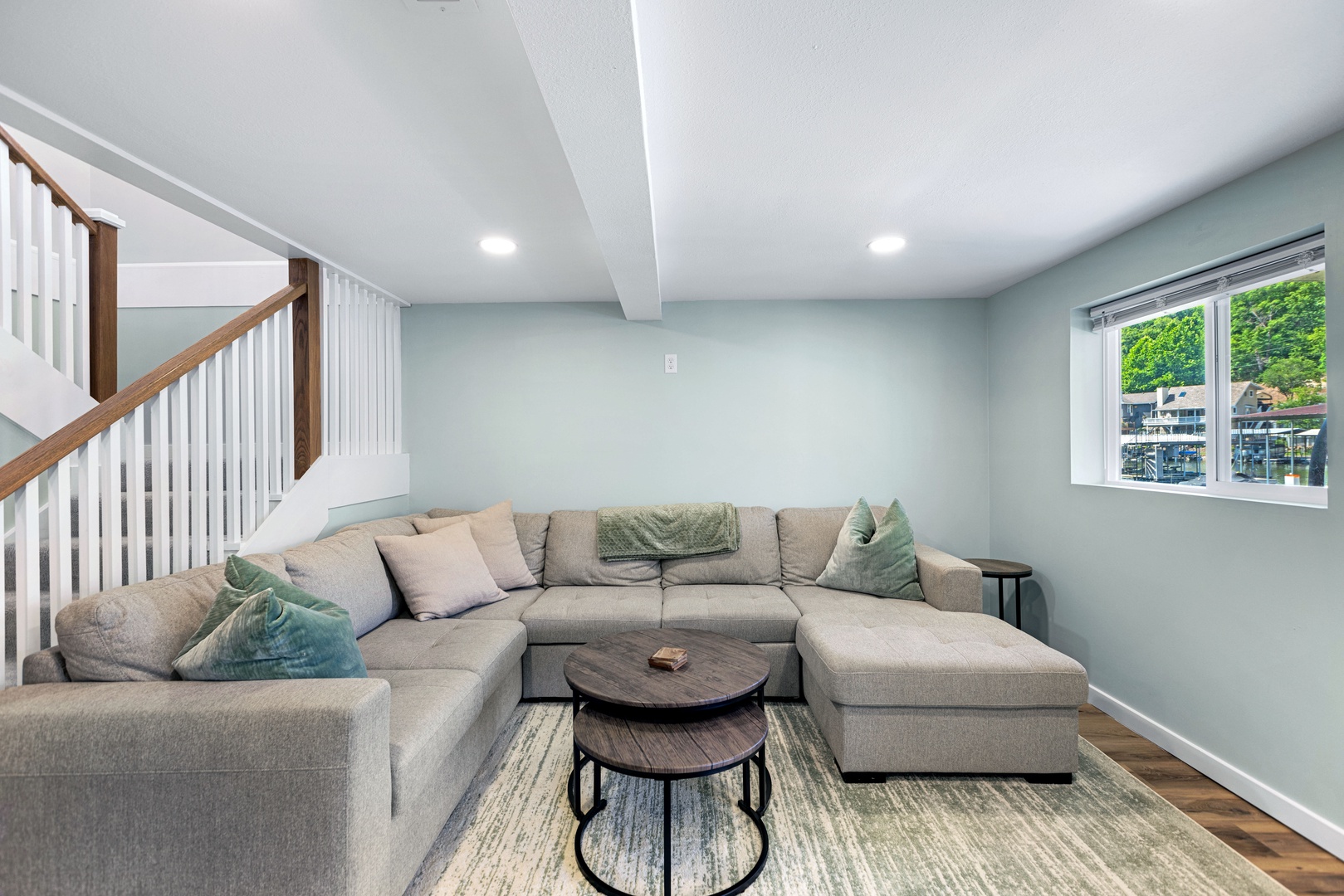 Basement space with sectional seating and Smart TV