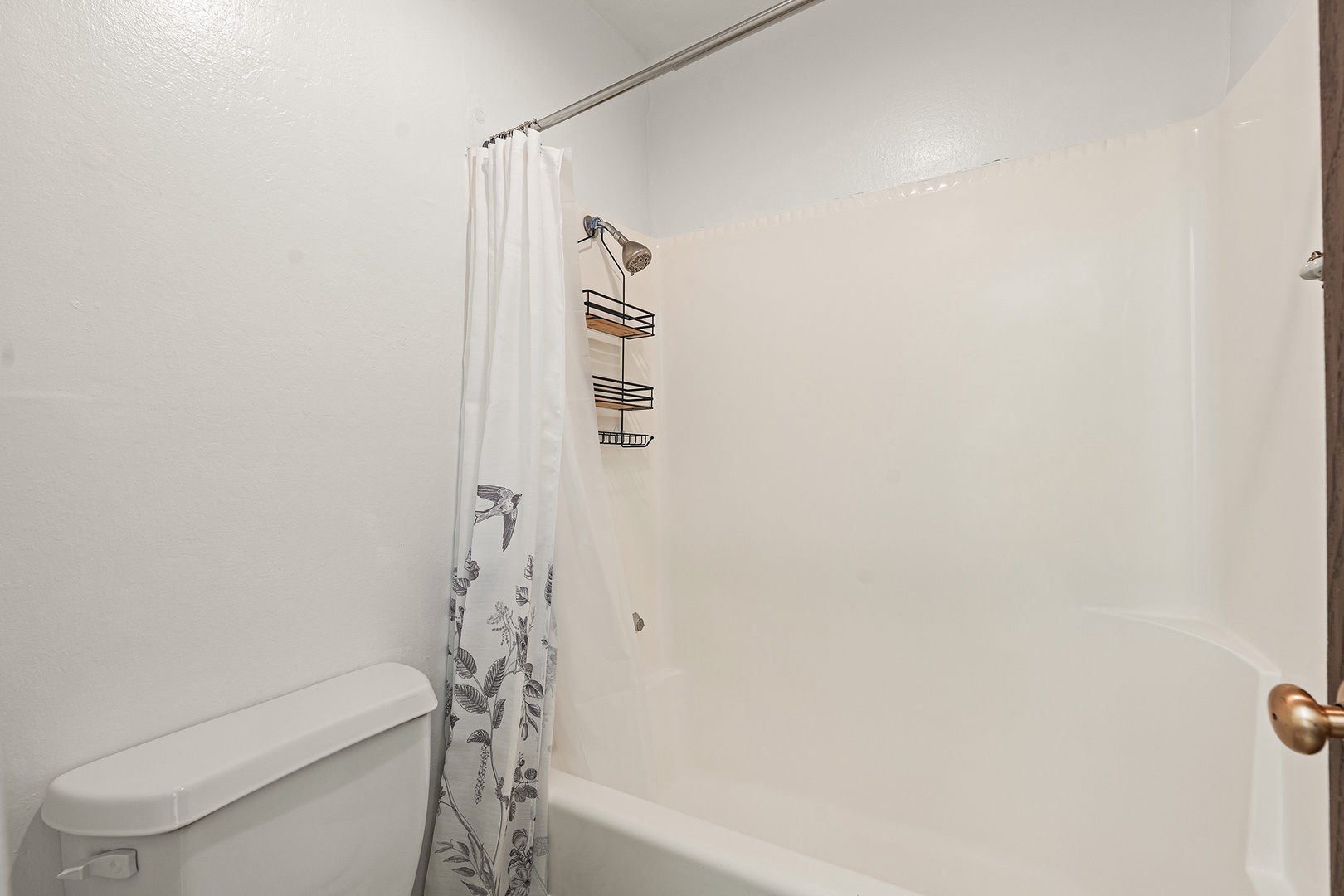 Shared bathroom with shower/tub combo