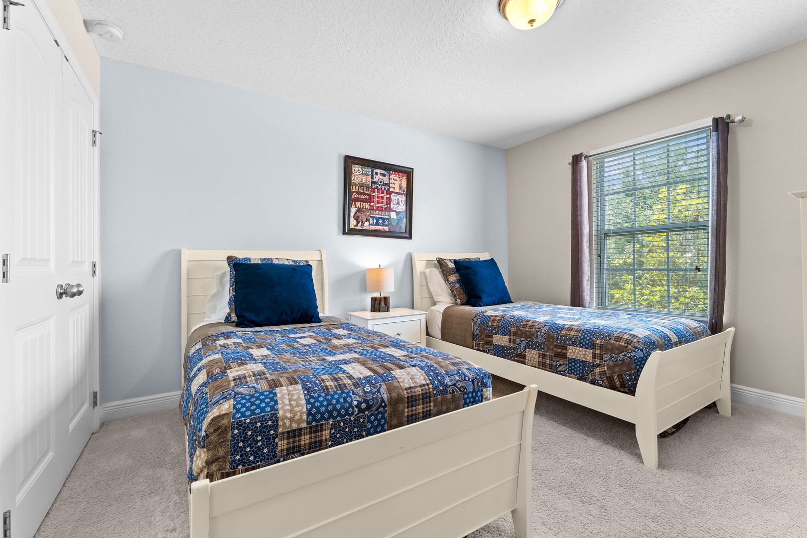 Bedroom 2 with 2 twin beds, Smart TV, and Jack & Jill style ensuite
