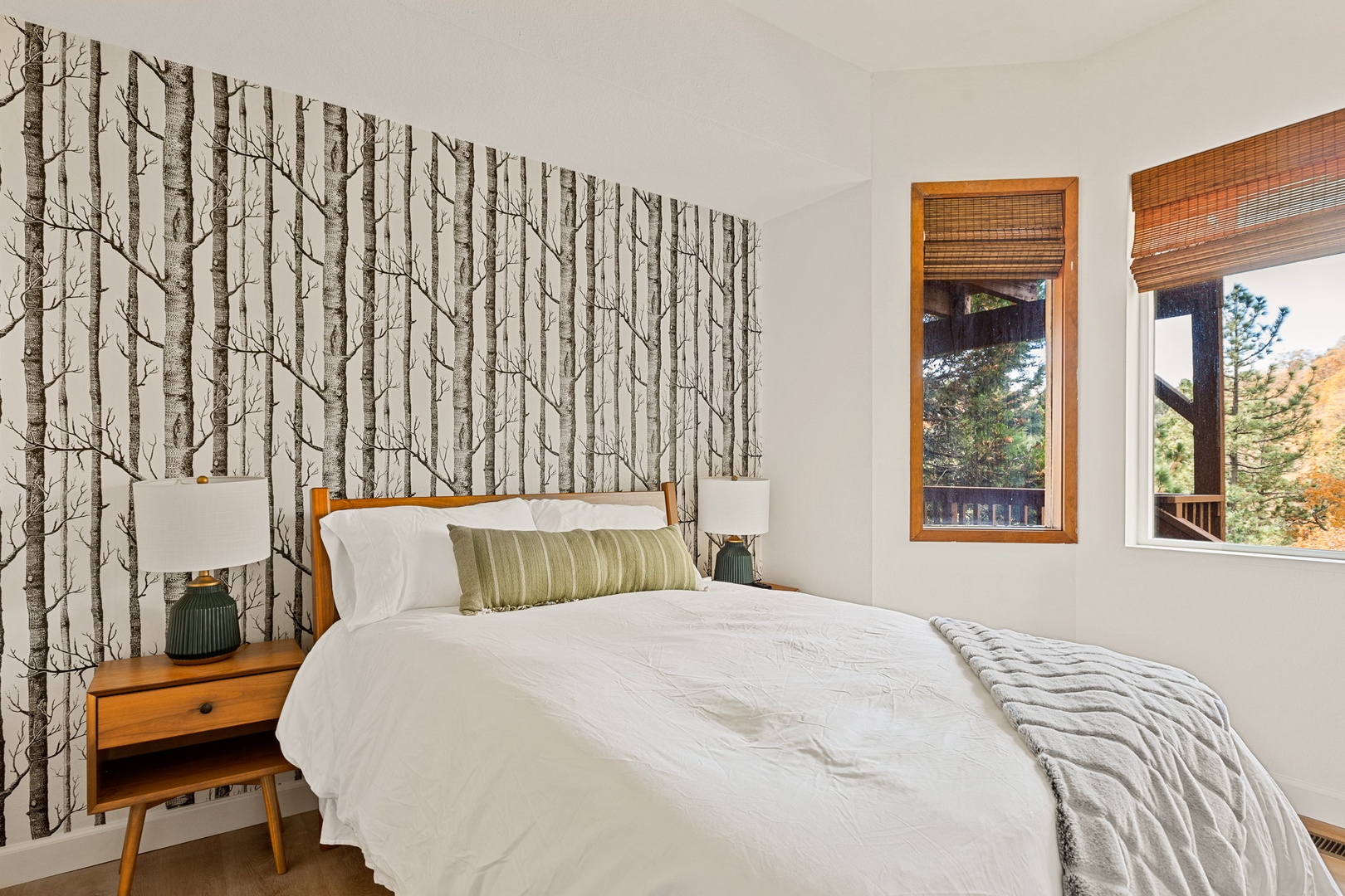 This gorgeous 1st floor bedroom includes a full-sized bed & Smart TV