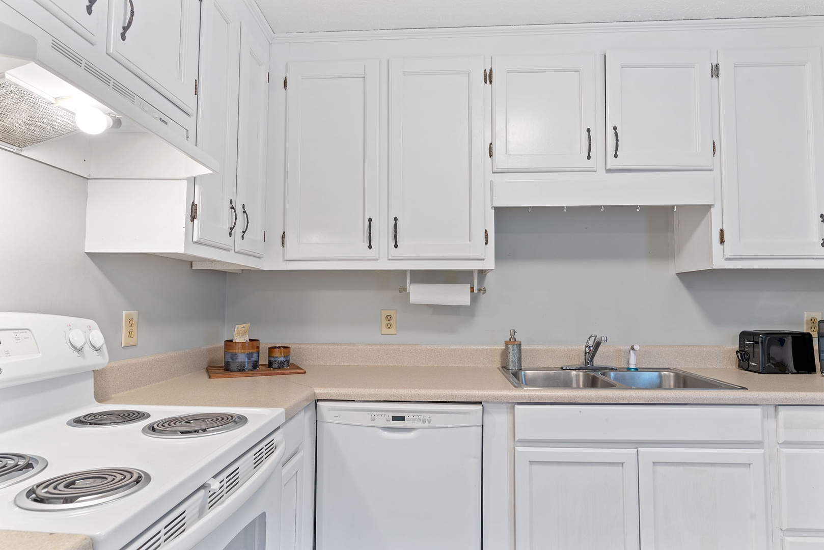 The sunny kitchen offers ample storage space & great amenities