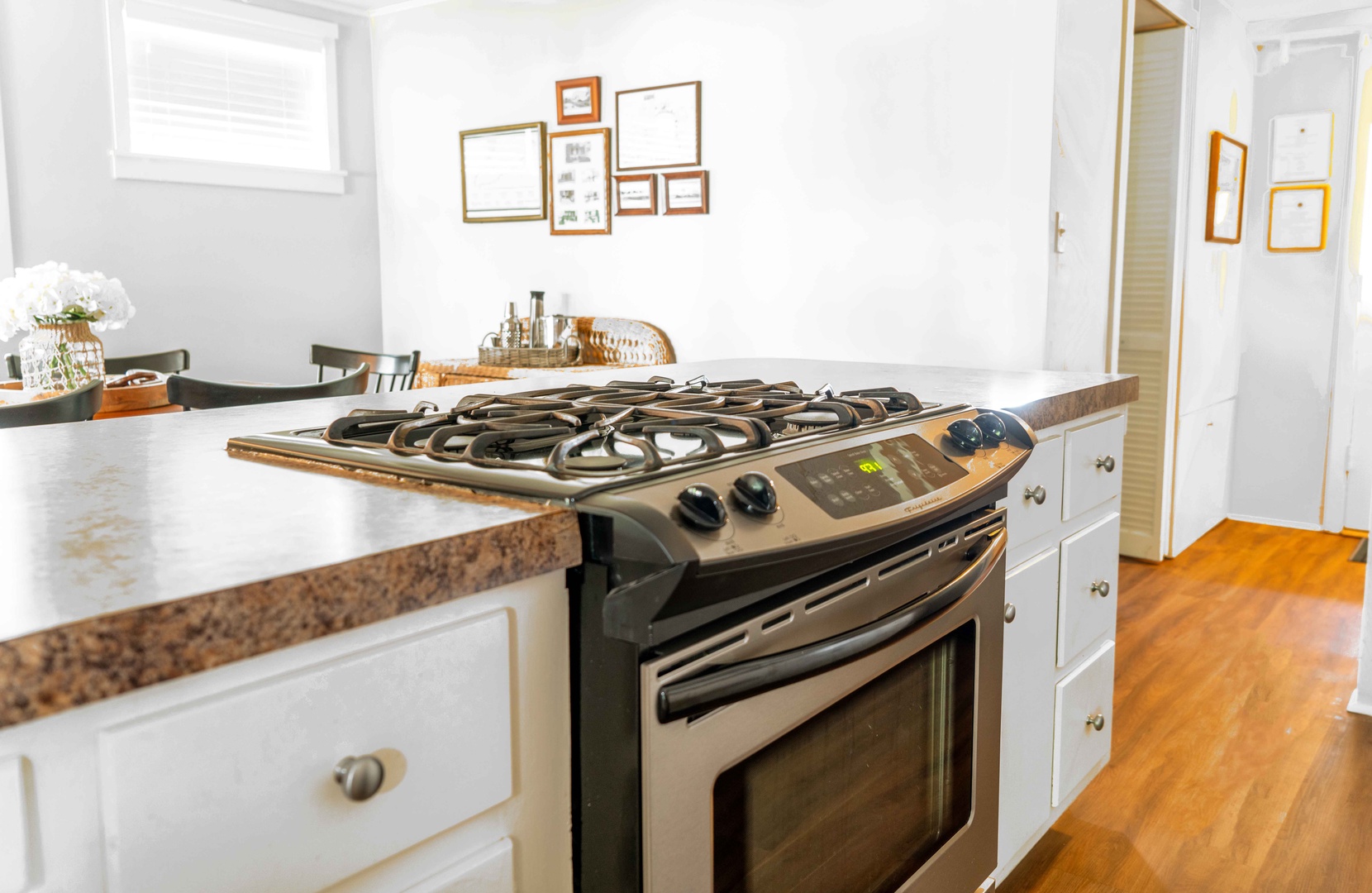 The cozy kitchen offers ample storage space & all the comforts of home