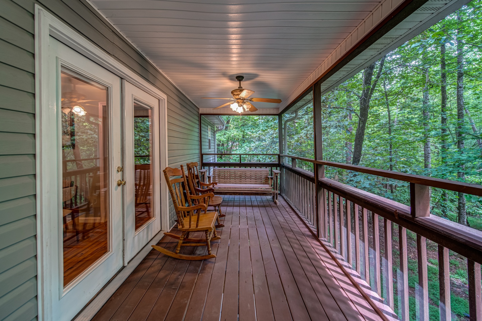 Enjoy treehouse views from the screened-in back deck