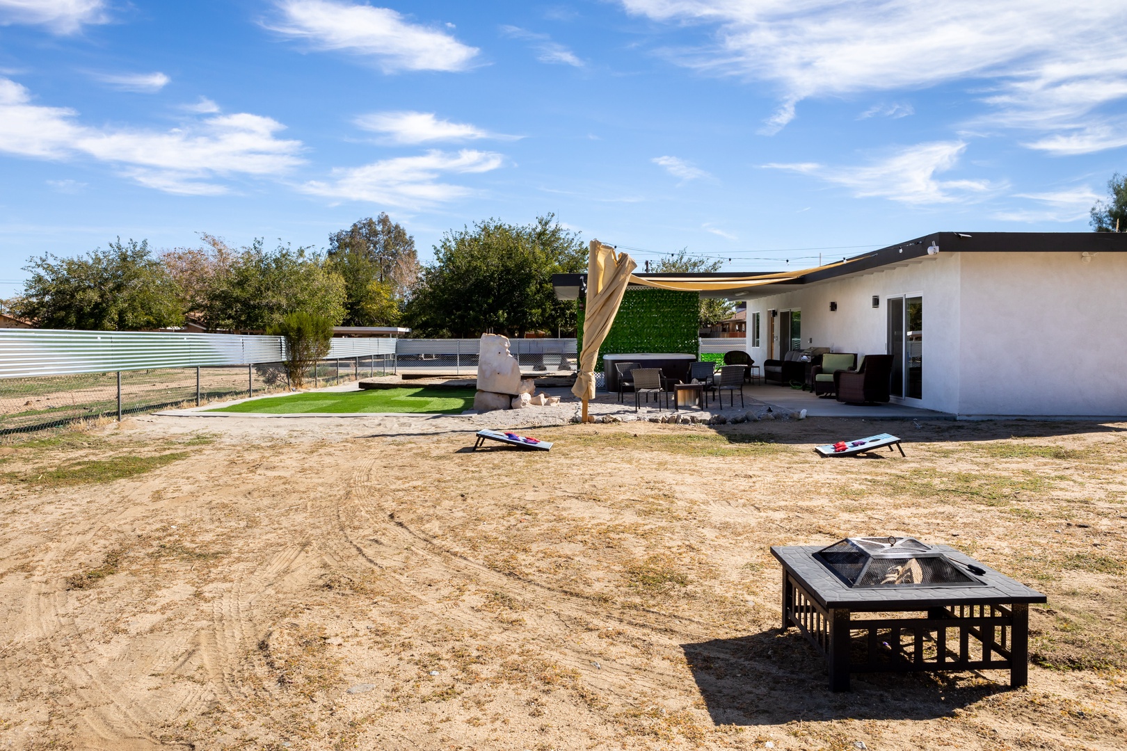 Enjoy the sun outback, firepit, hot tub, and more!