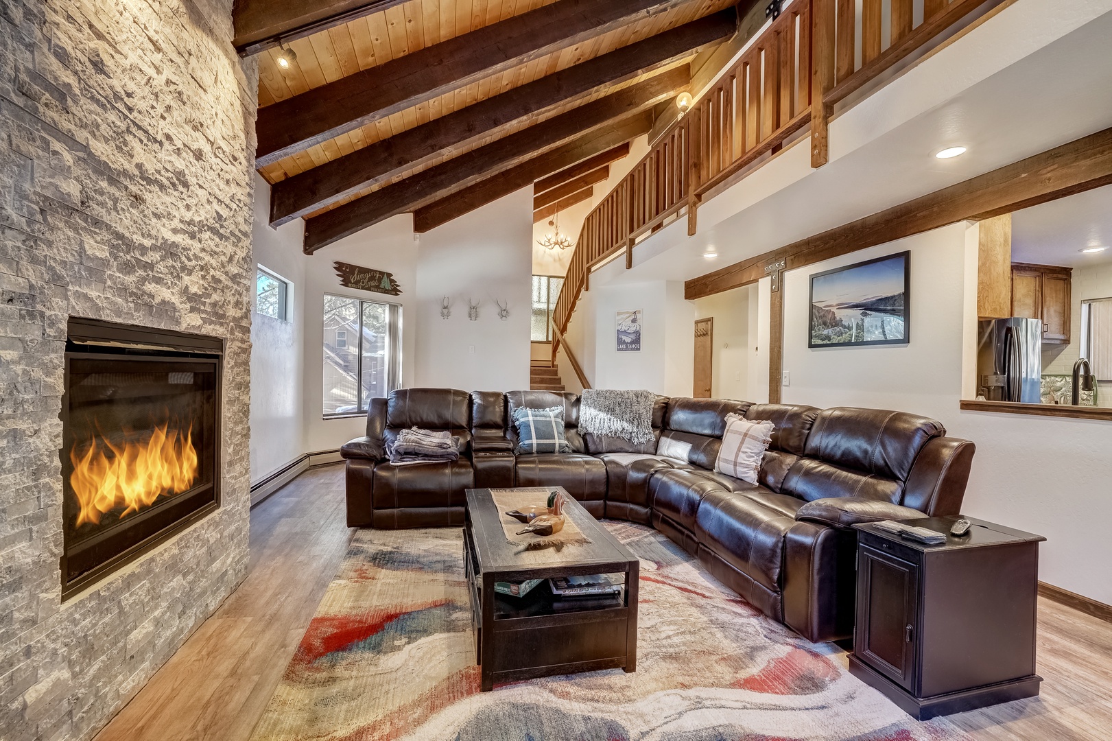 Open living space with TV, fireplace, and deck (Main floor)