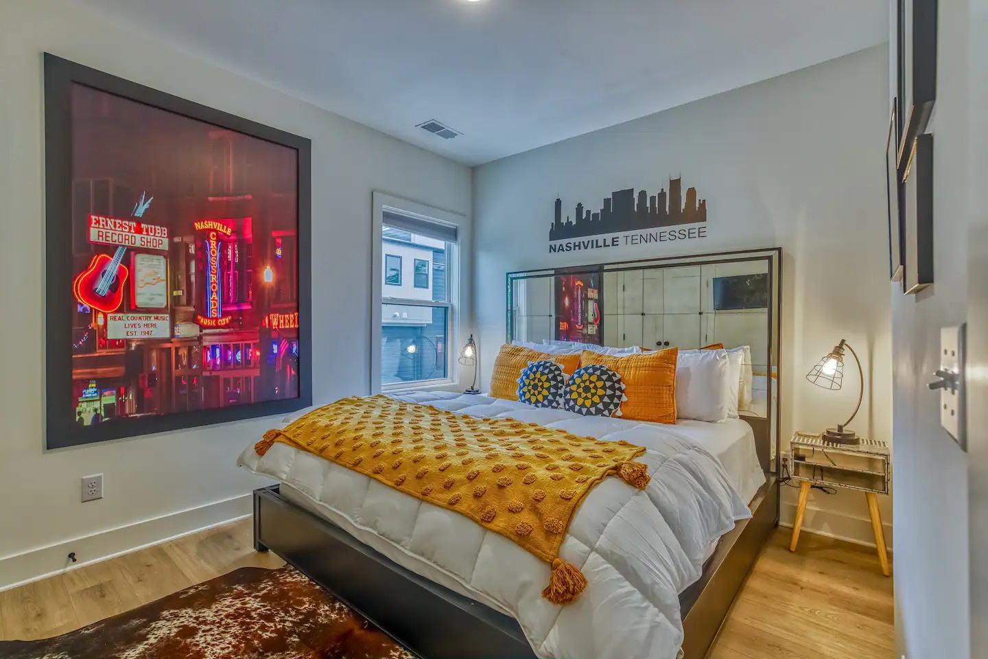 This stylish second floor bedroom offers guests a cozy king bed & Smart TV
