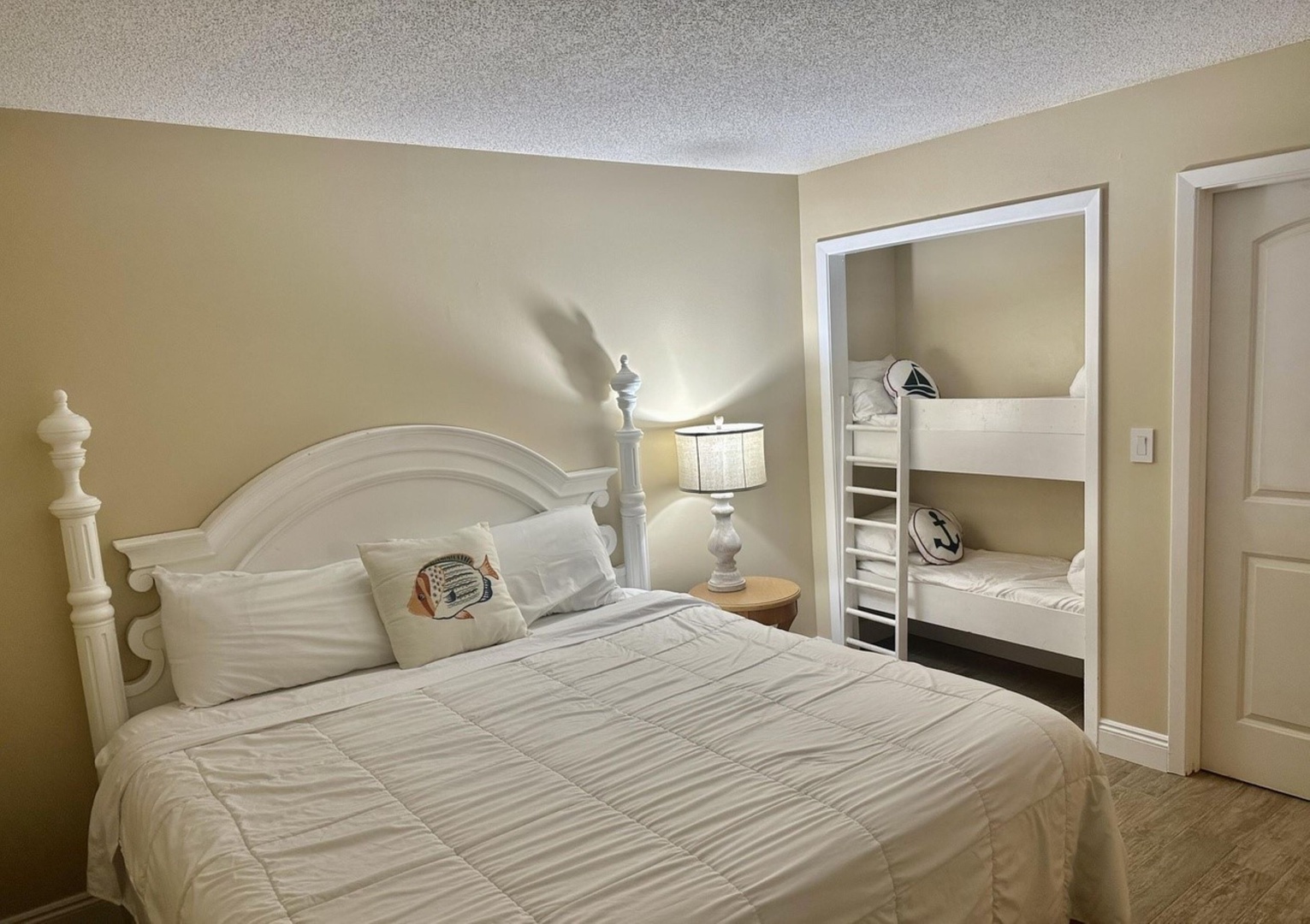 Bedroom with king bed, twin/twin bunk bed, and ensuite