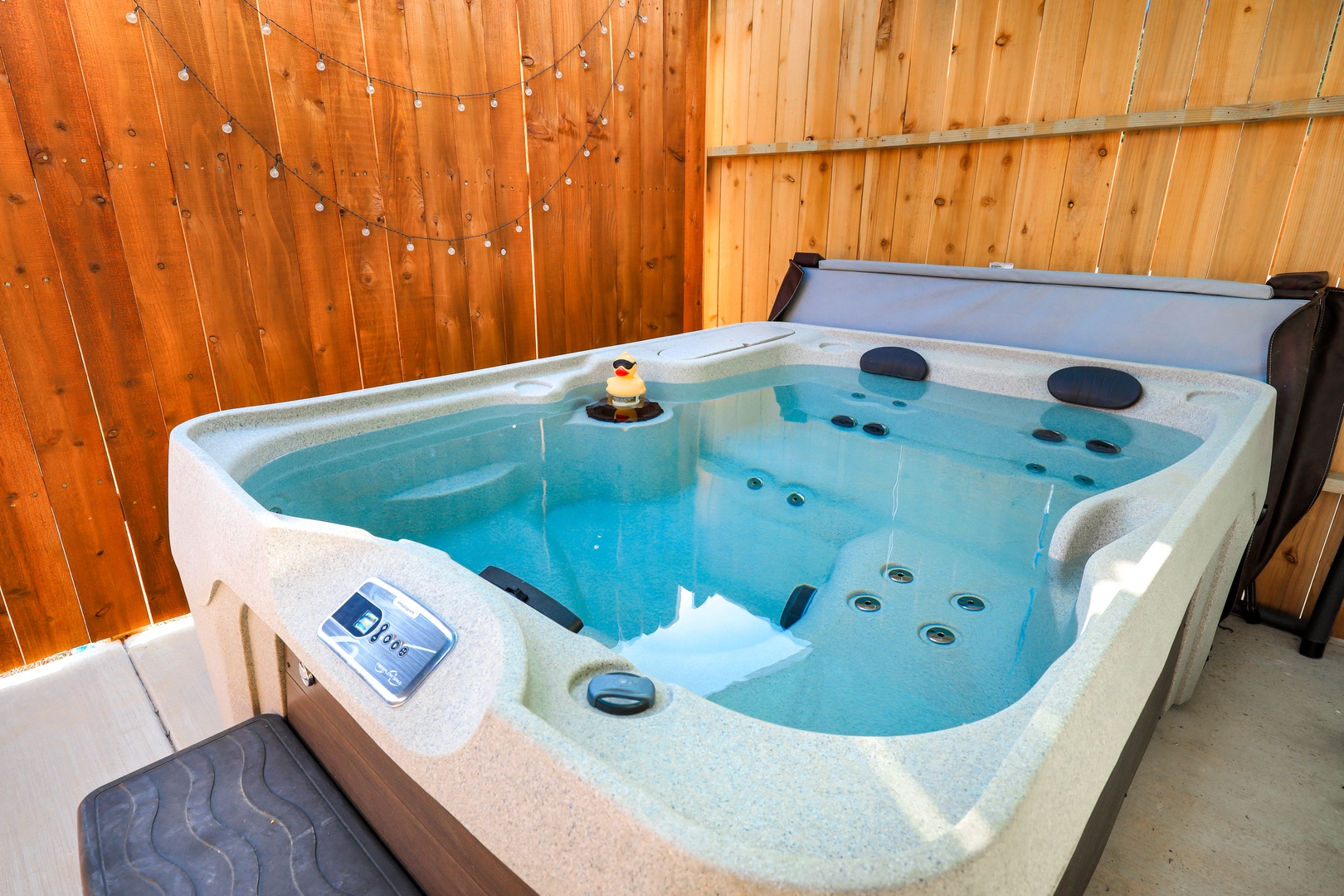 Soak your cares away on the private patio in your private hot tub