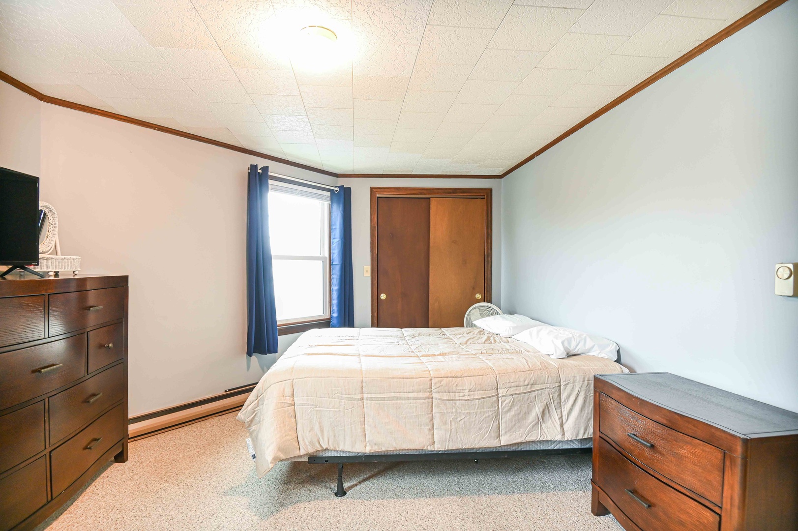 Bedroom 1 with queen bed, and Smart TV