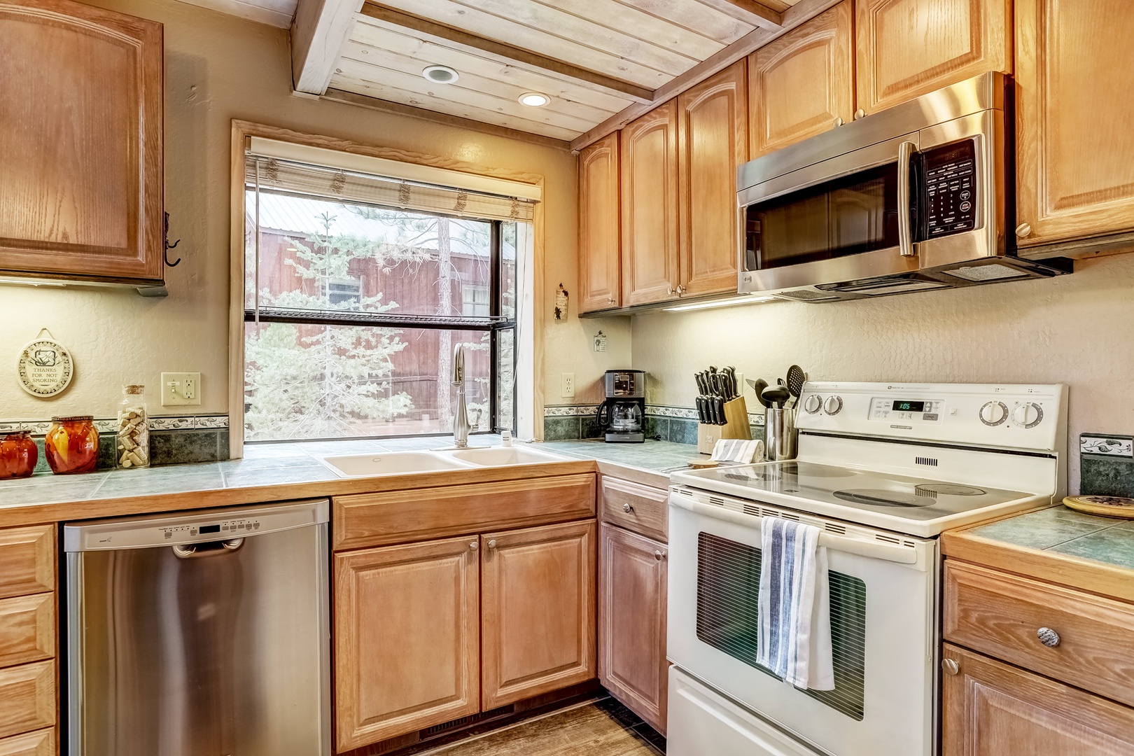 Kitchen with drip coffee maker, dishwasher, microwave and more