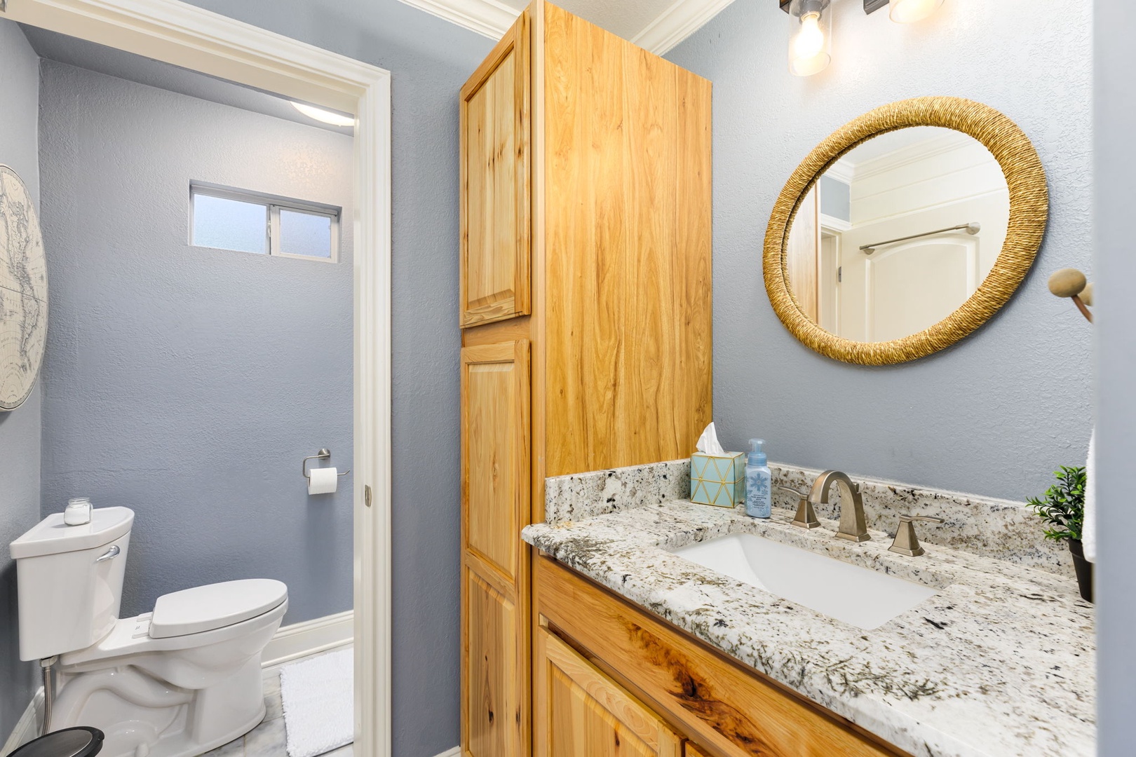 The cabin’s full bathroom features a vanity with storage & shower