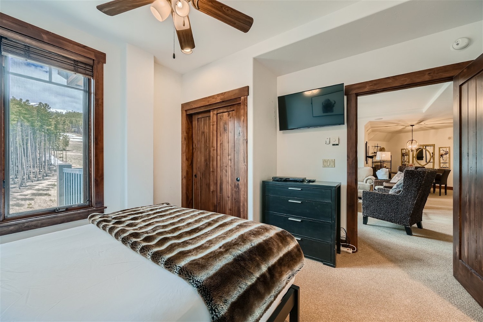 This serene suite offers a full-sized bed, Smart TV, & ensuite bath