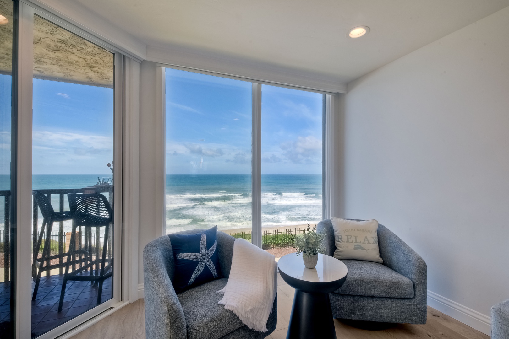 Curl up in the breezy living room & enjoy streaming with a stunning view