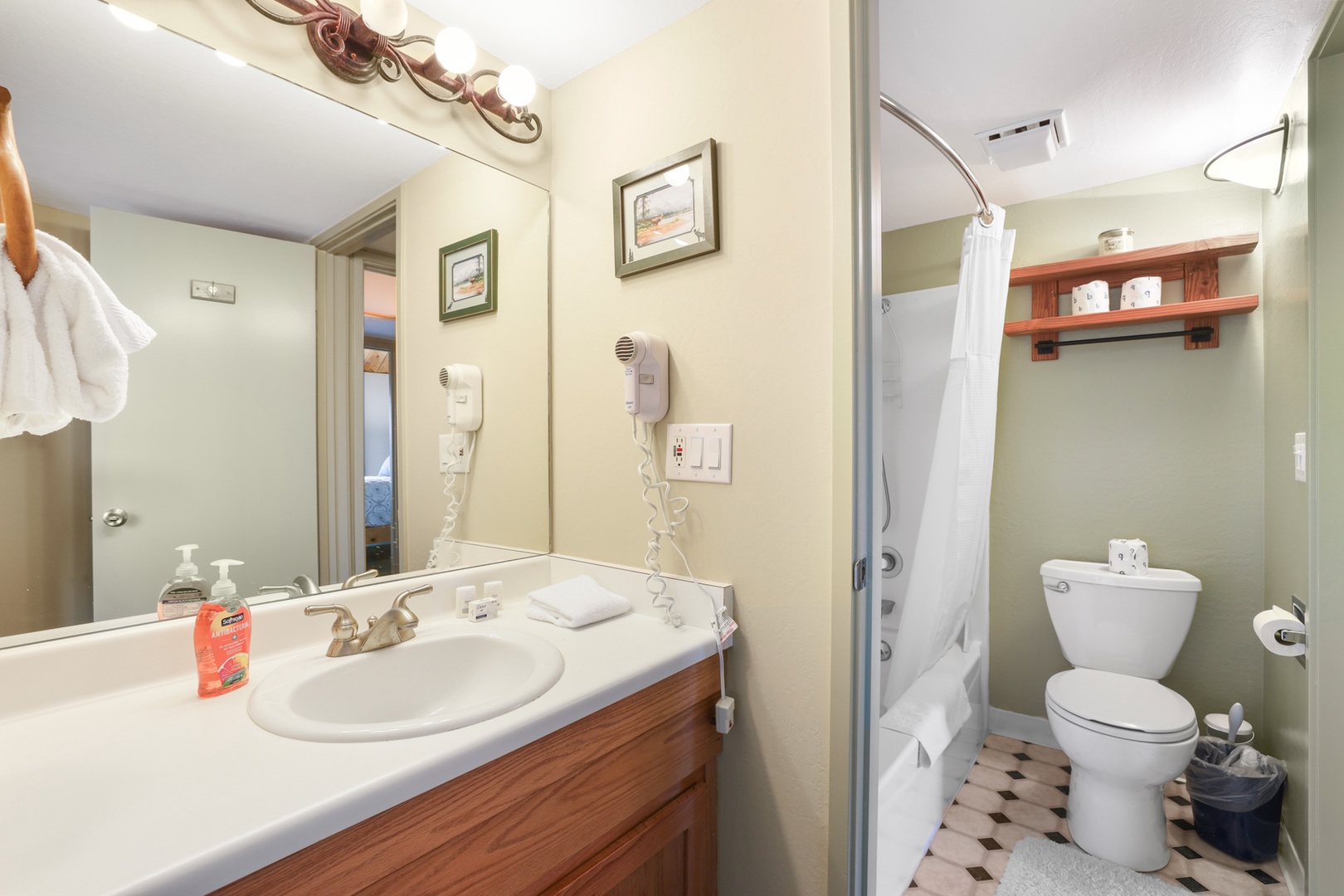 Jack and Jill style bathroom with shower/tub combo