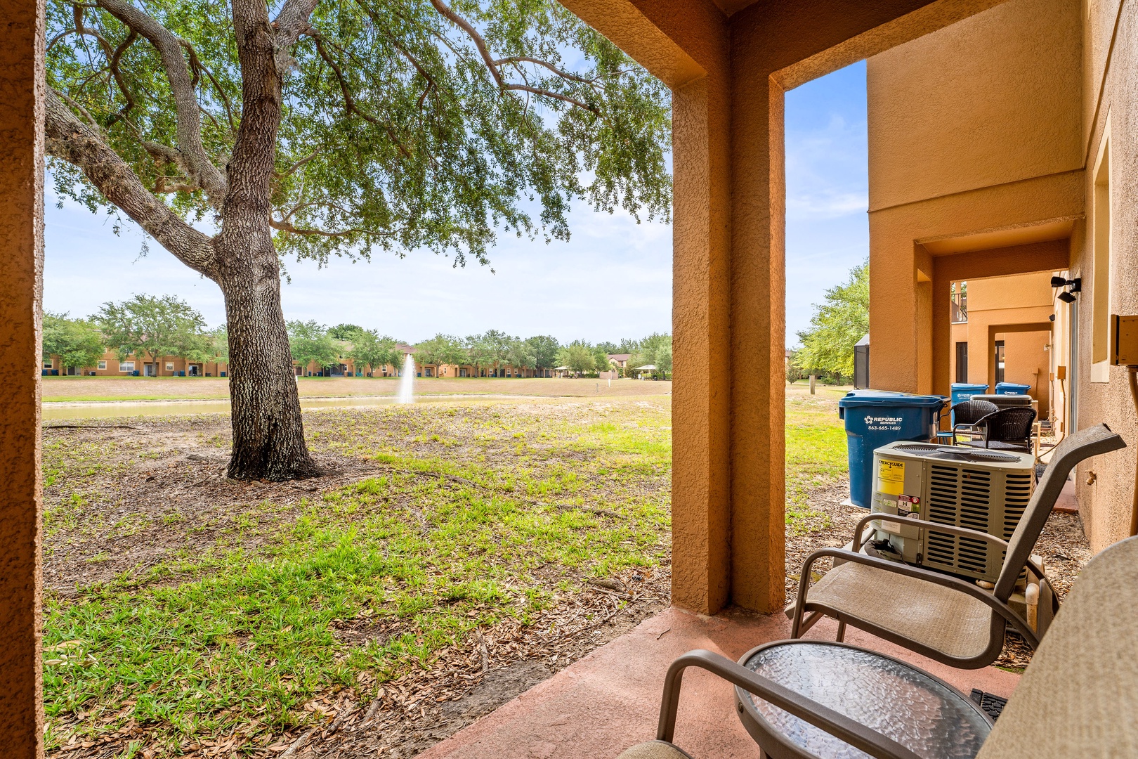 Cozy patio with seating for two and a relaxing garden view