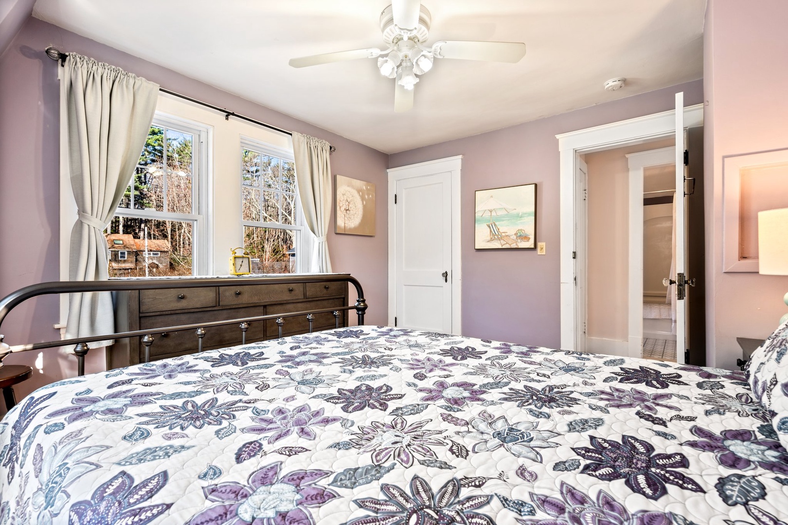 The 2nd floor queen bedroom showcases a cozy bed