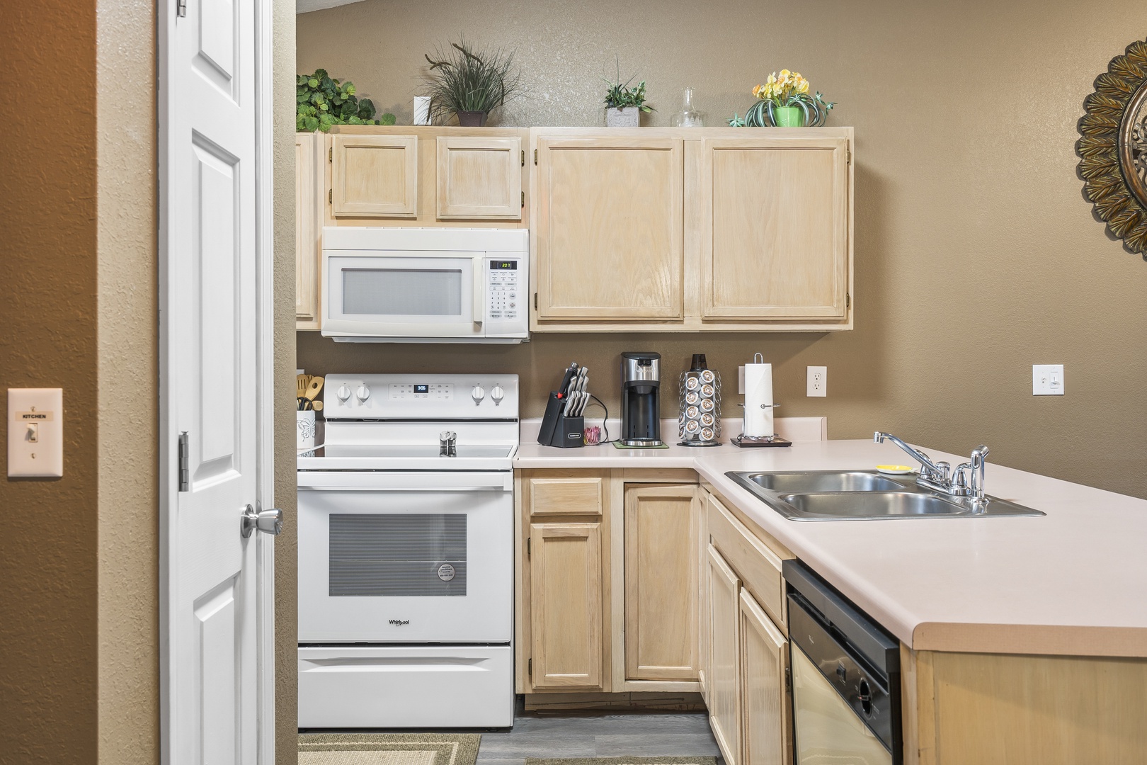 The open kitchen offers ample space & all the comforts of home