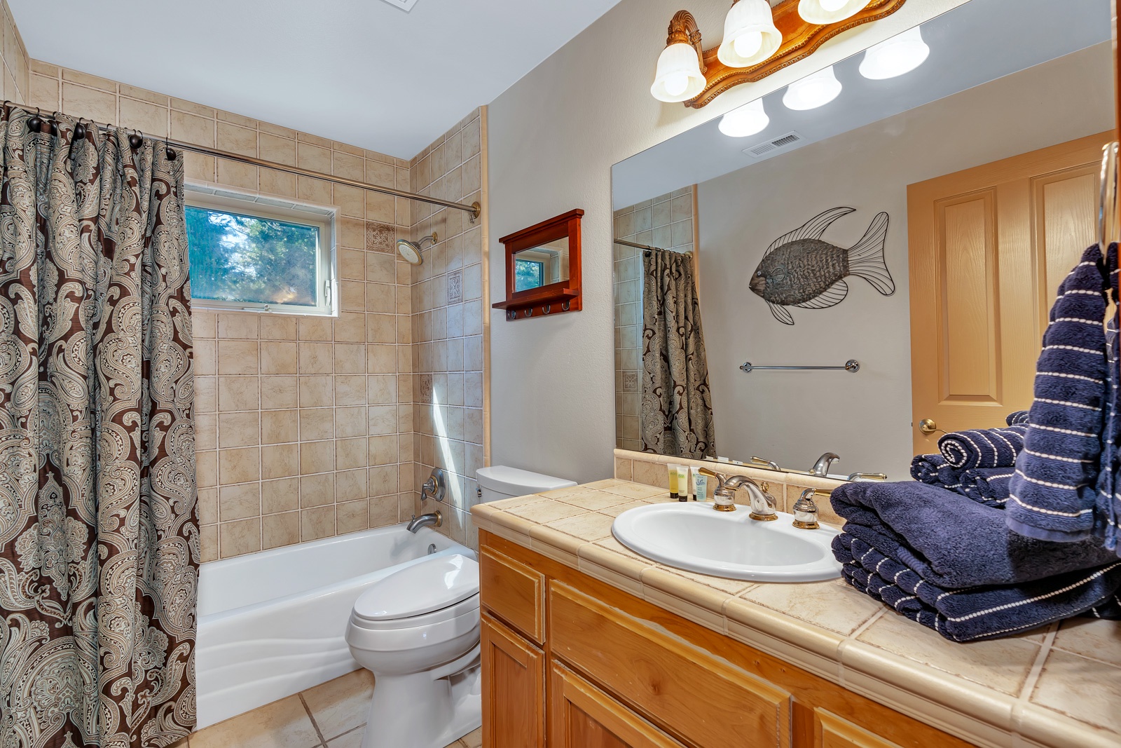 This 2nd floor full bathroom includes a single vanity & shower/tub combo