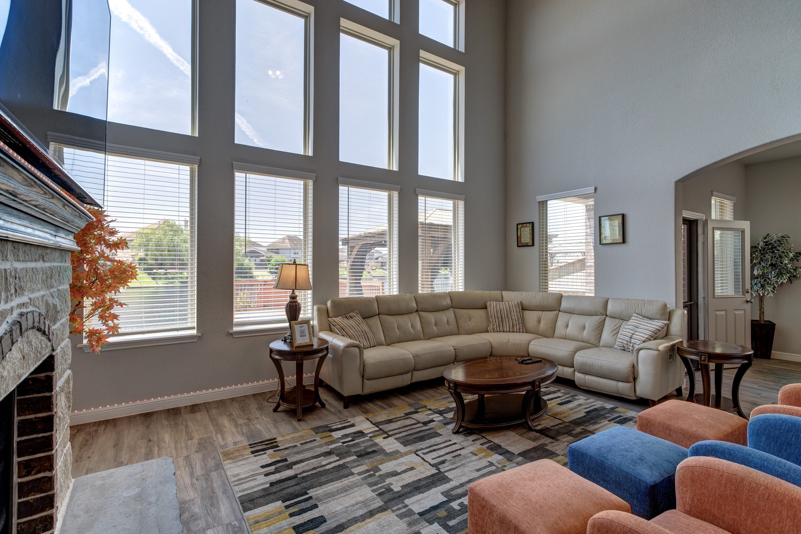 Bright living area with ample seating, fireplace, and Smart TV