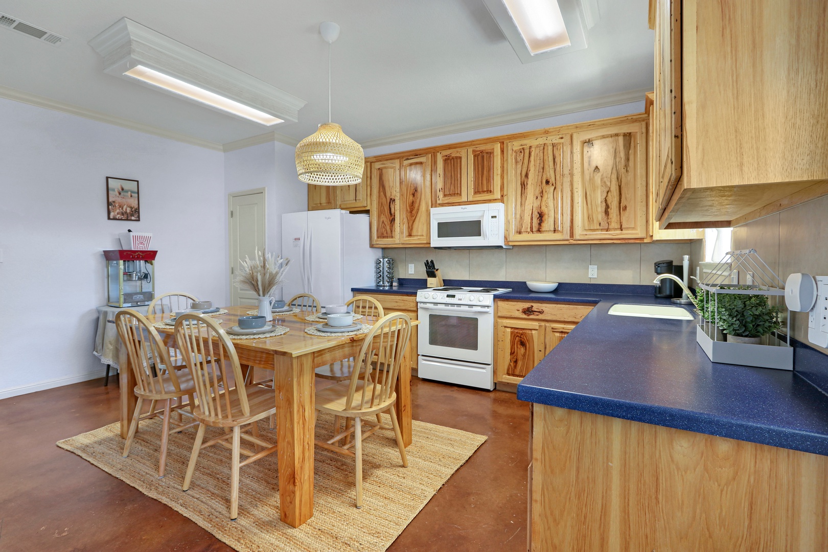 The spacious eat-in kitchen is well equipped for your visit to New Braunfels
