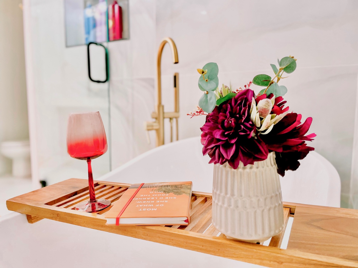 Bedroom 1’s ensuite boasts a dual vanity, shower, & luxurious soaking tub