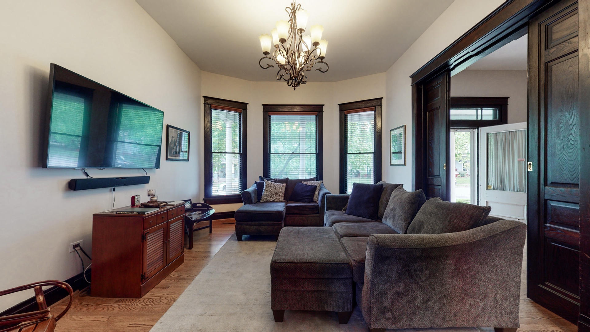 Living room with comfortable seating around a flat screen TV