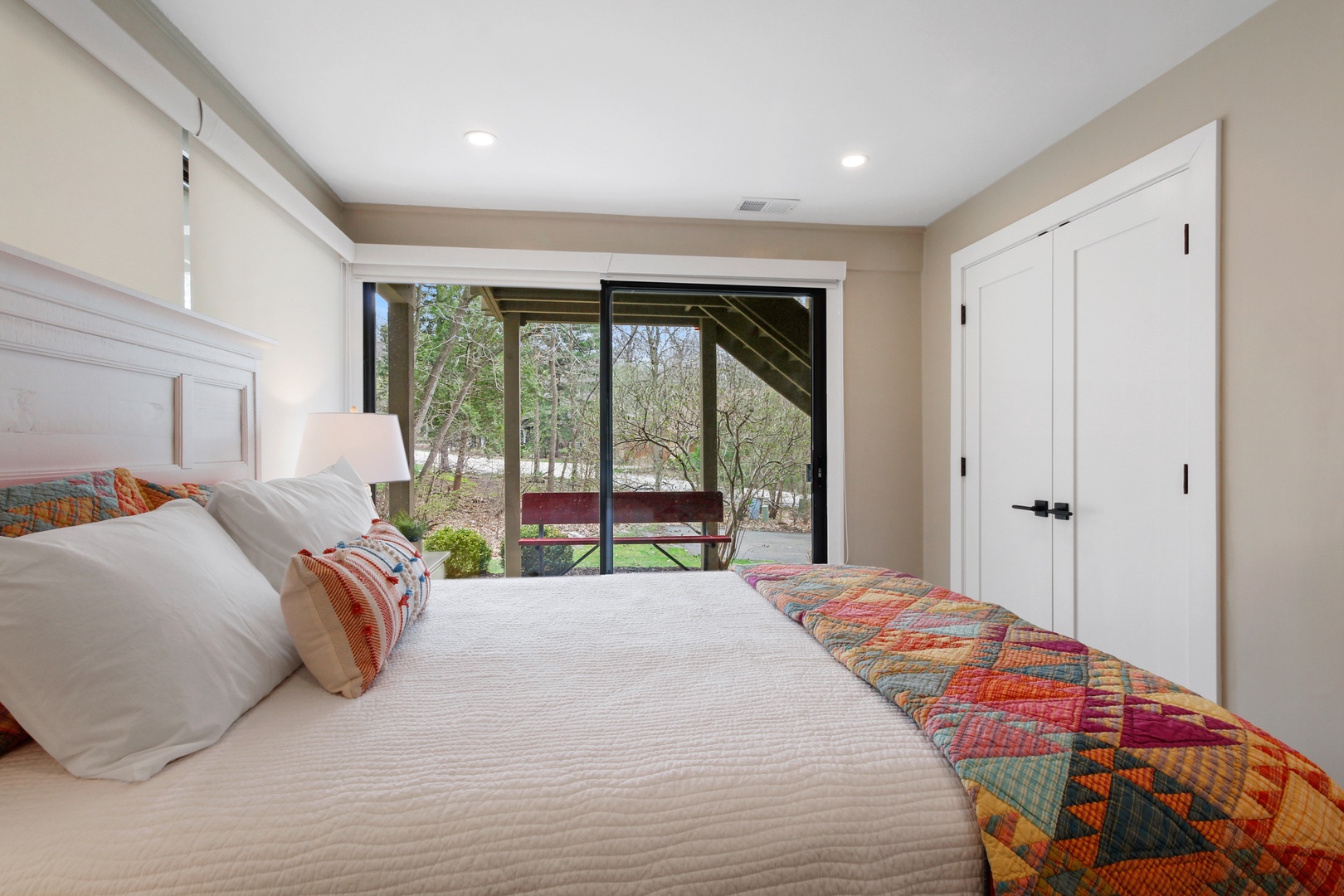 The second bedroom retreat includes a queen bed & deck access