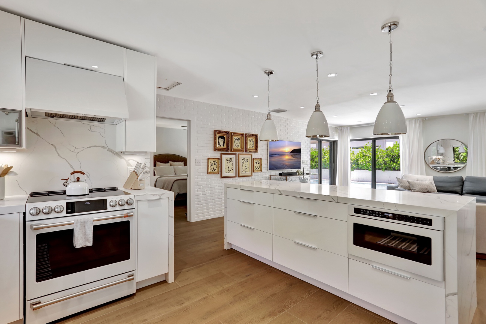 The chic, open kitchen offers ample space & all the comforts of home