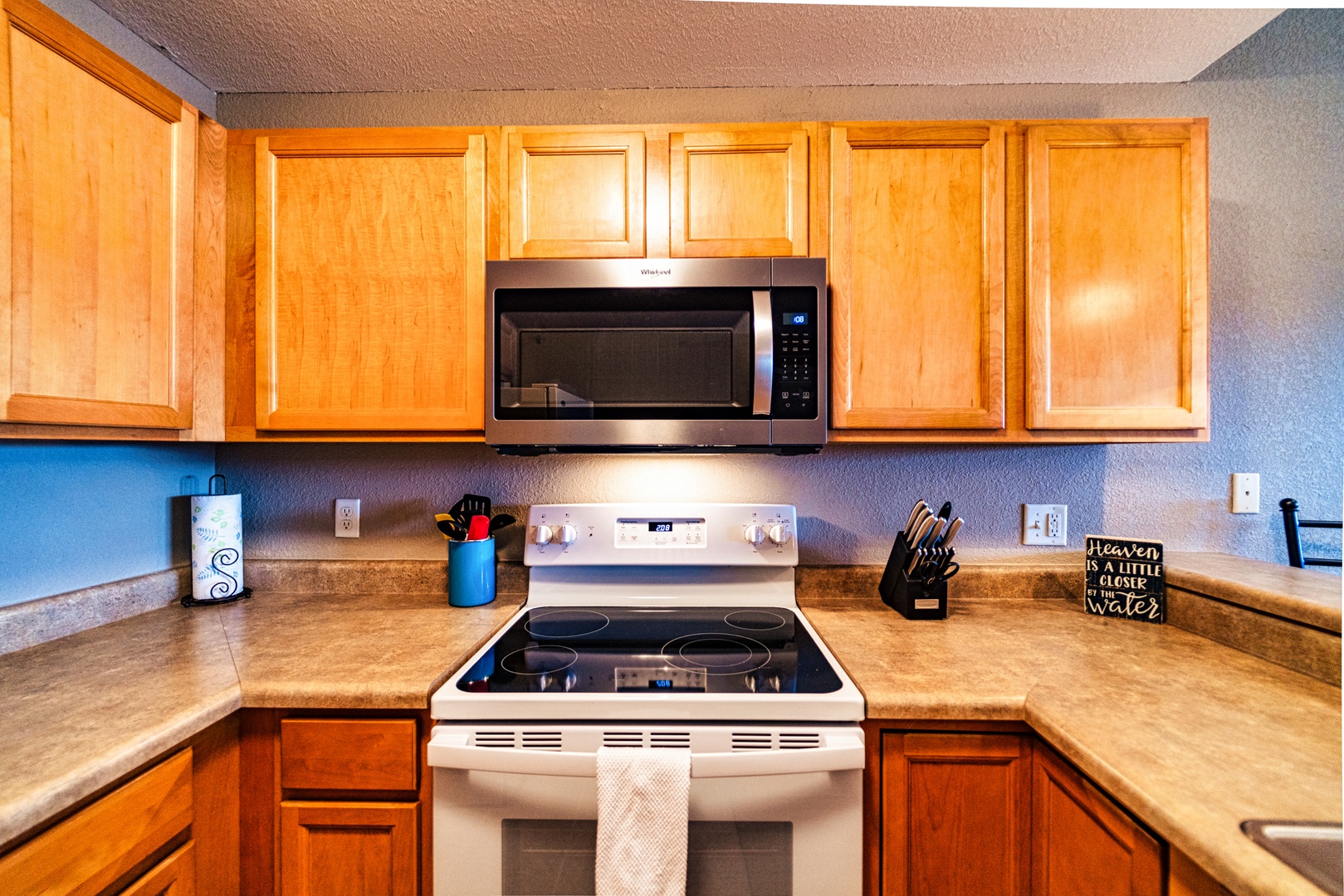 This quaint kitchen offers ample space & all the comforts of home