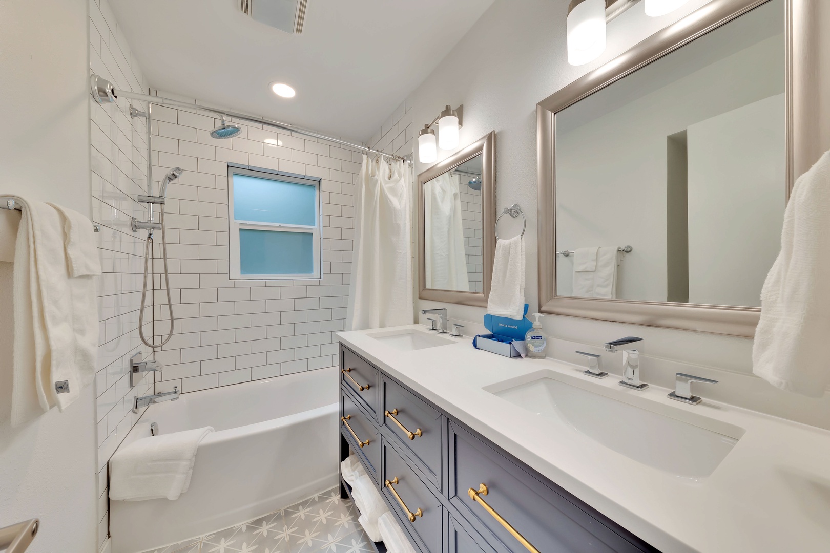The hall bathroom offers an oversized double vanity & shower/tub combo