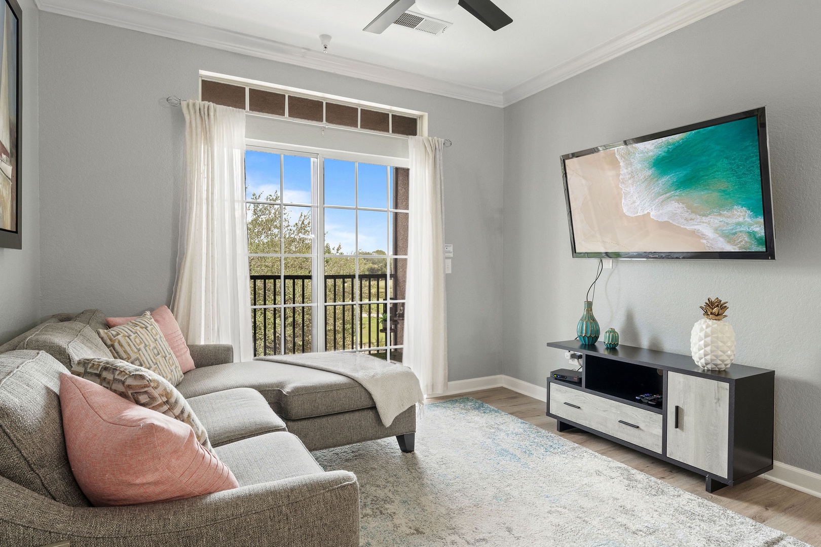 Bright living room with sofa sleeper and Smart TV