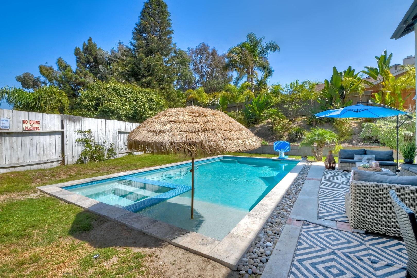 Backyard with ample seating and private pool