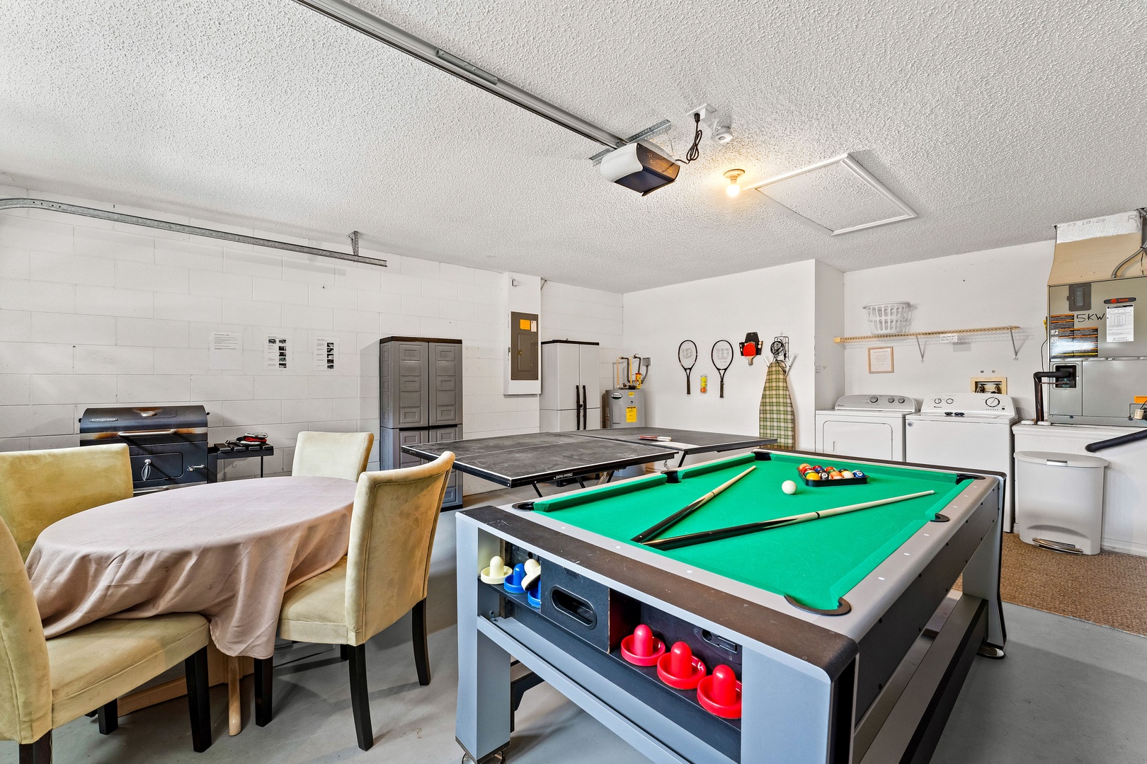 Game night haven: Pool table, air hockey, ping pong & seating for 4