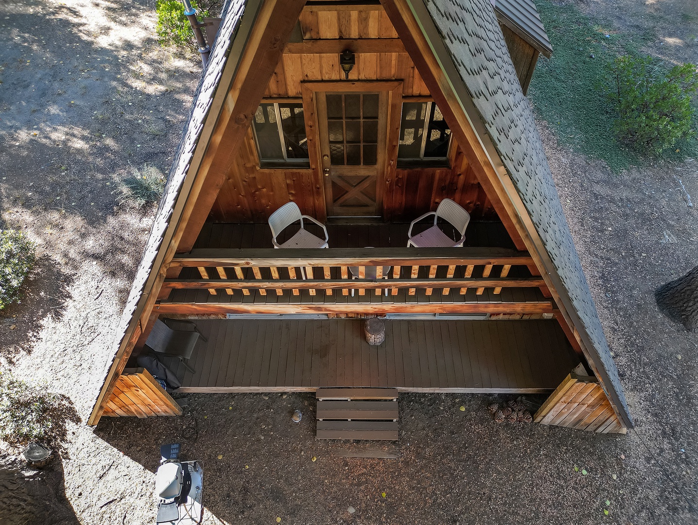 Patio chairs on both floors offer relaxing views of nature