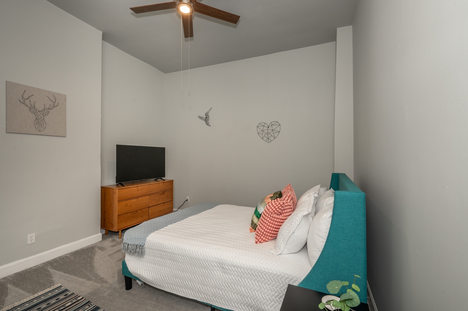 Kick back and relax in your Queen Bedroom with Smart TV and Ceiling Fan