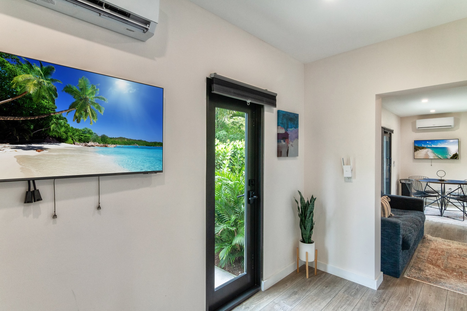 Bedroom with queen bed, work station, Smart Tv and patio access