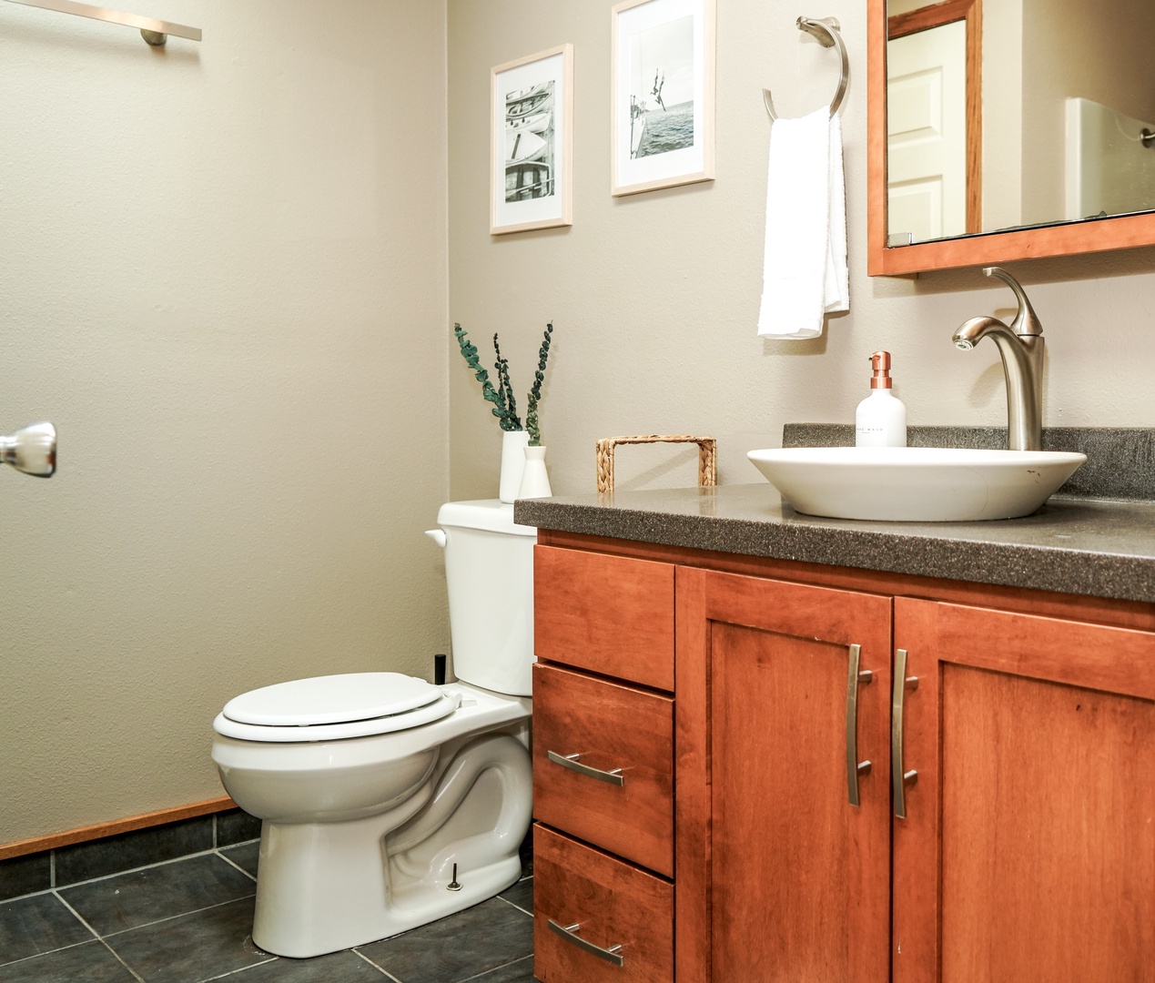 The shared bathroom includes a single vanity & shower/tub combo