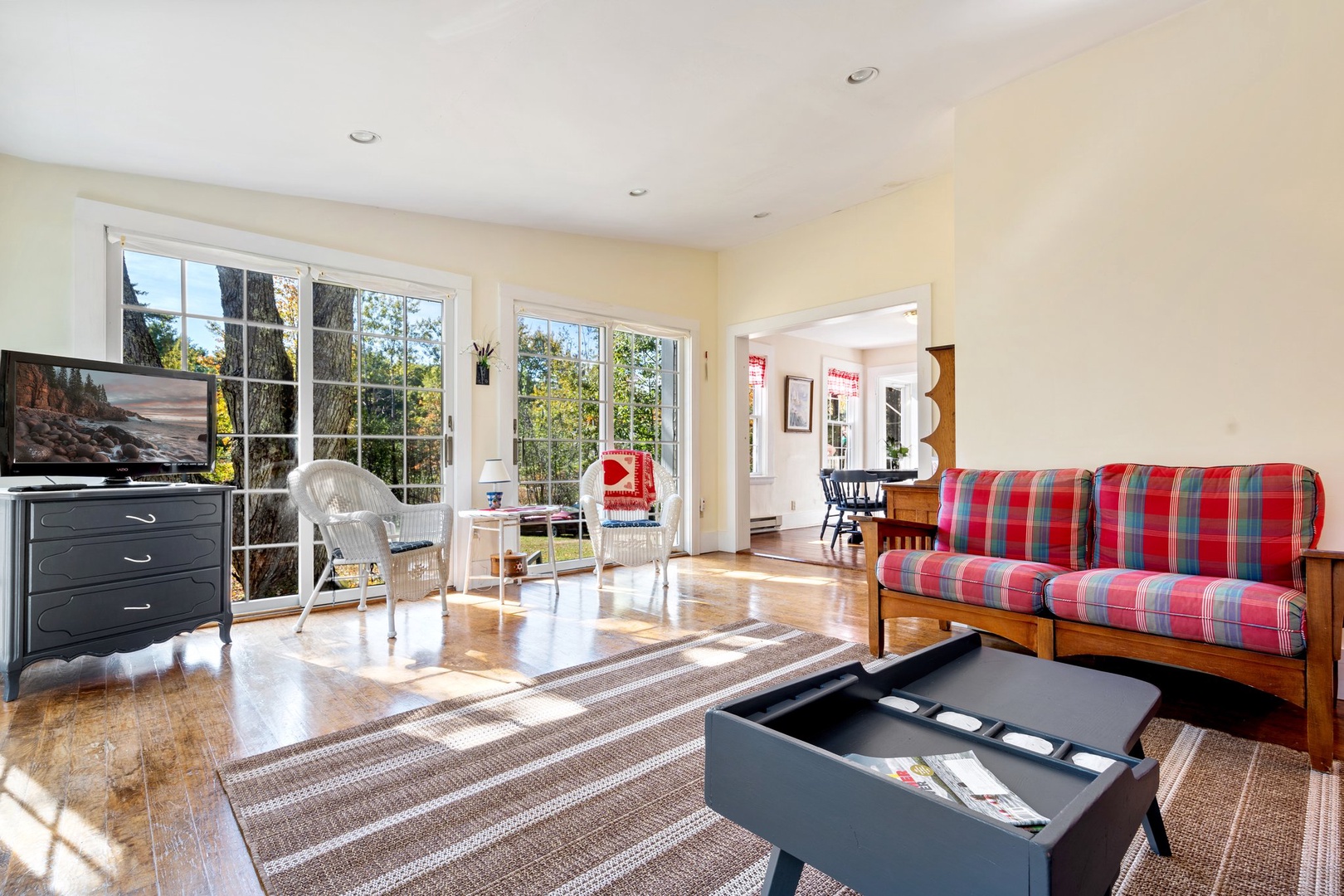 Bright living area with ample seating and Smart TV