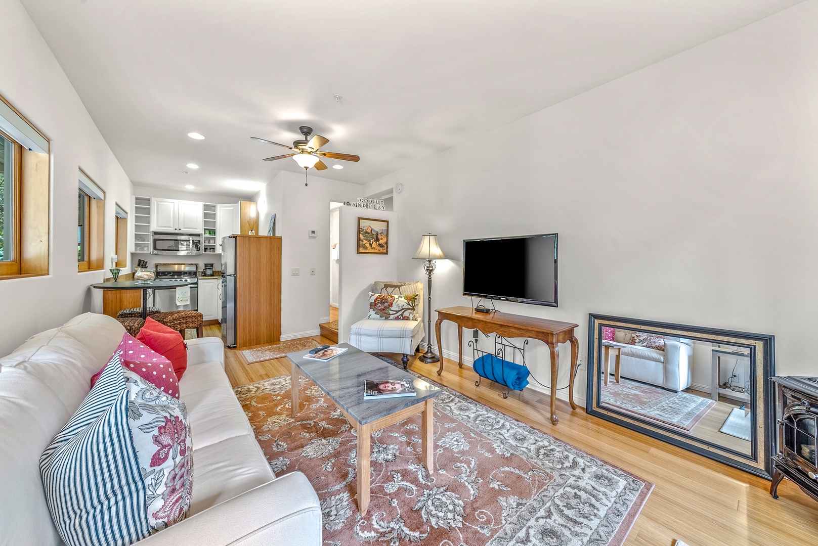 Bright living area with cozy seating and Smart TV