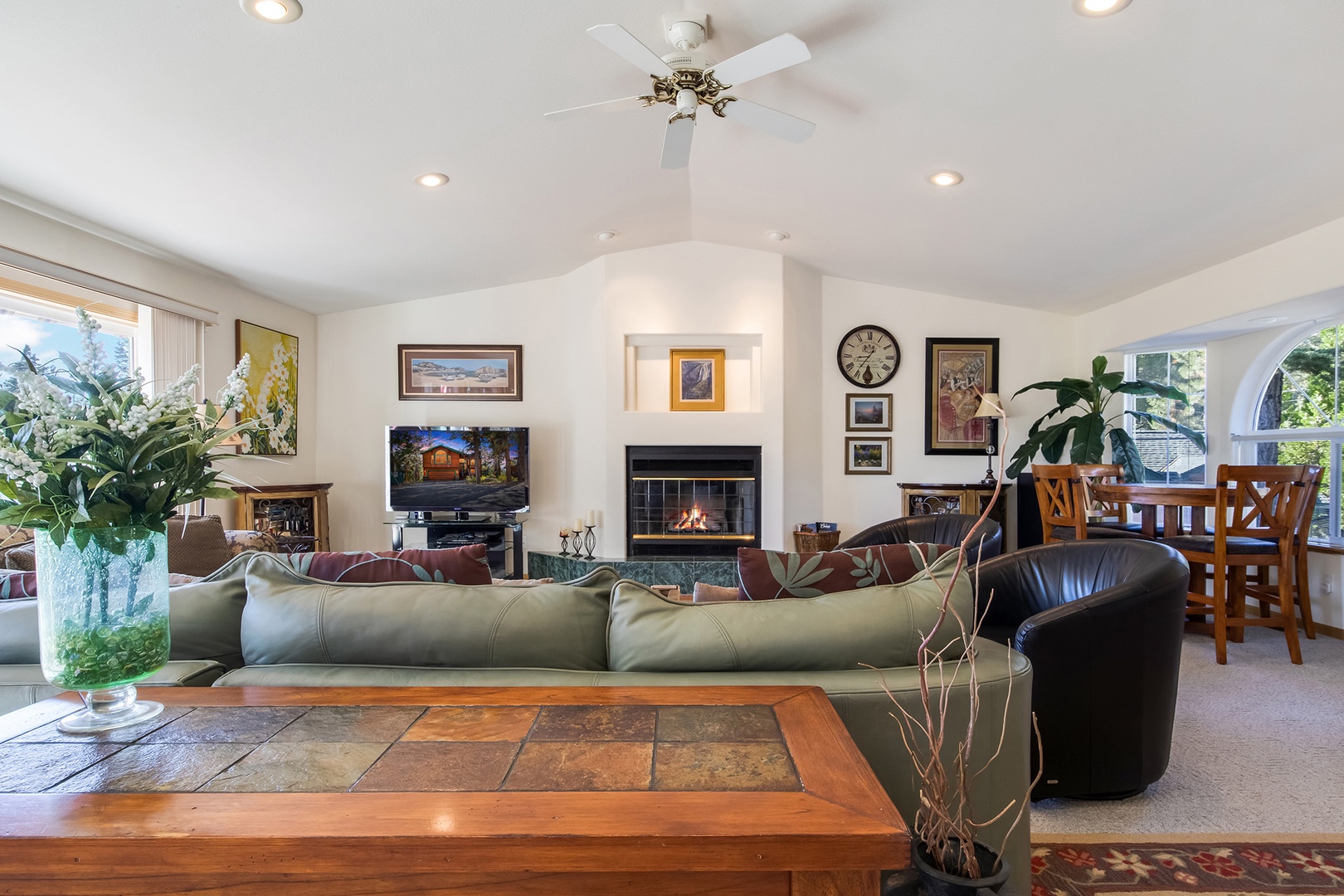 Bright living space with ample seating, fireplace, and Smart TV