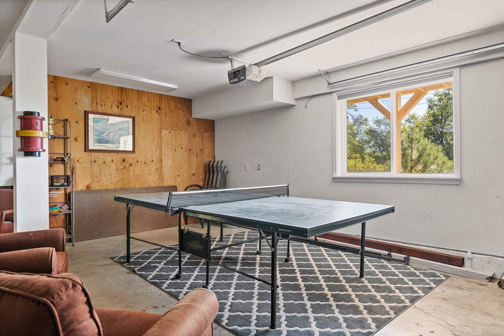 Another game room located in the garage with ping pong