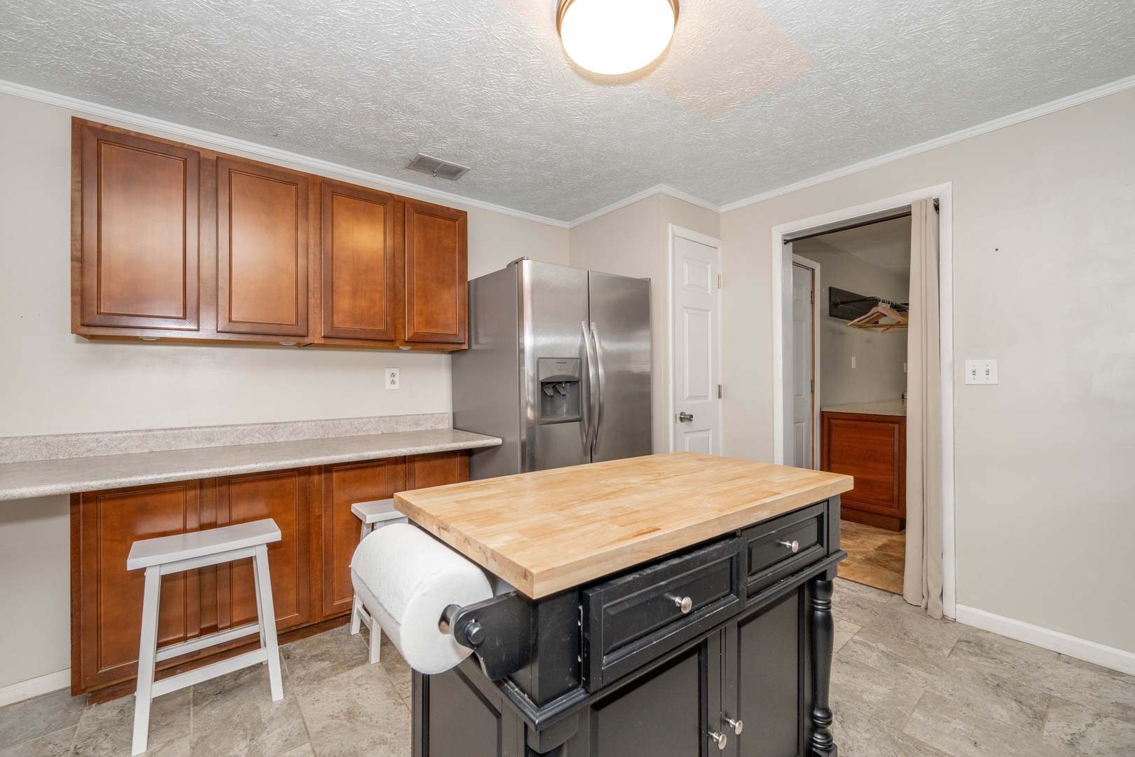 The spacious kitchen offers ample storage & all the comforts of home