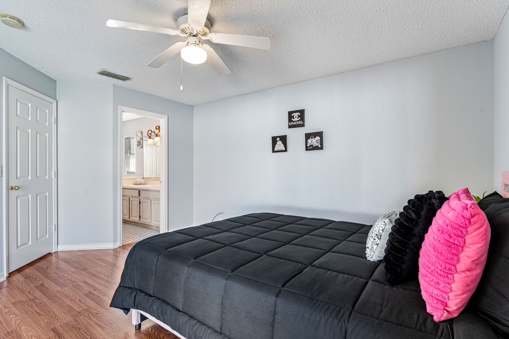 Bedroom 4 with queen bed, patio access, and ensuite