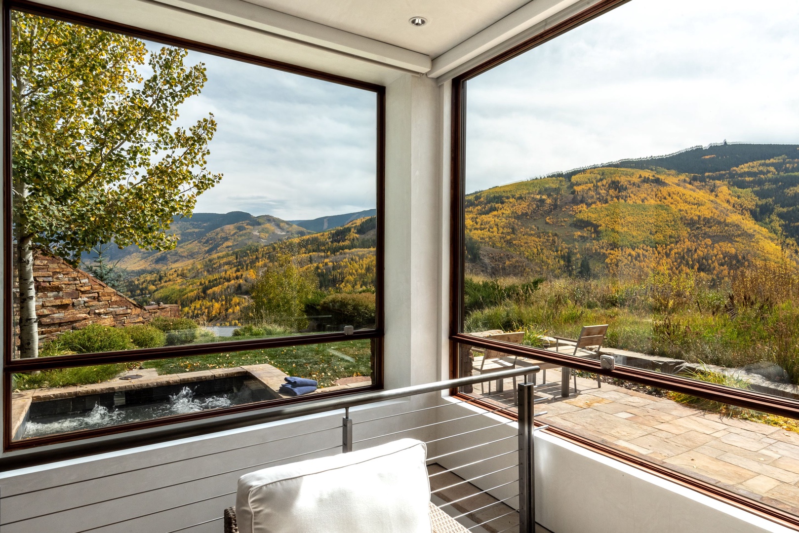 Lounge in the sunshine or soak in the hot tub on the upper-level patio
