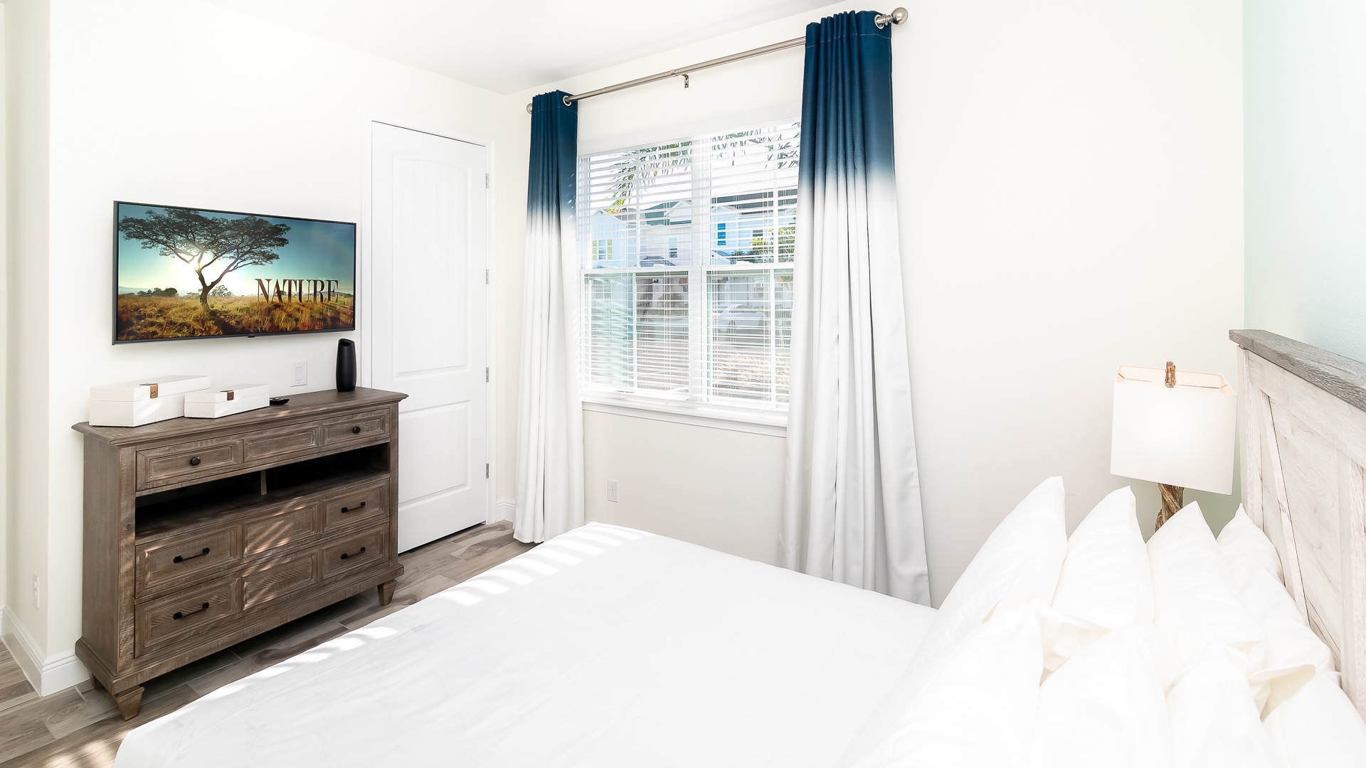 Bedroom 4: Escape to this First Floor Queen Bedroom with Smart TV and Ceiling Fan with remote