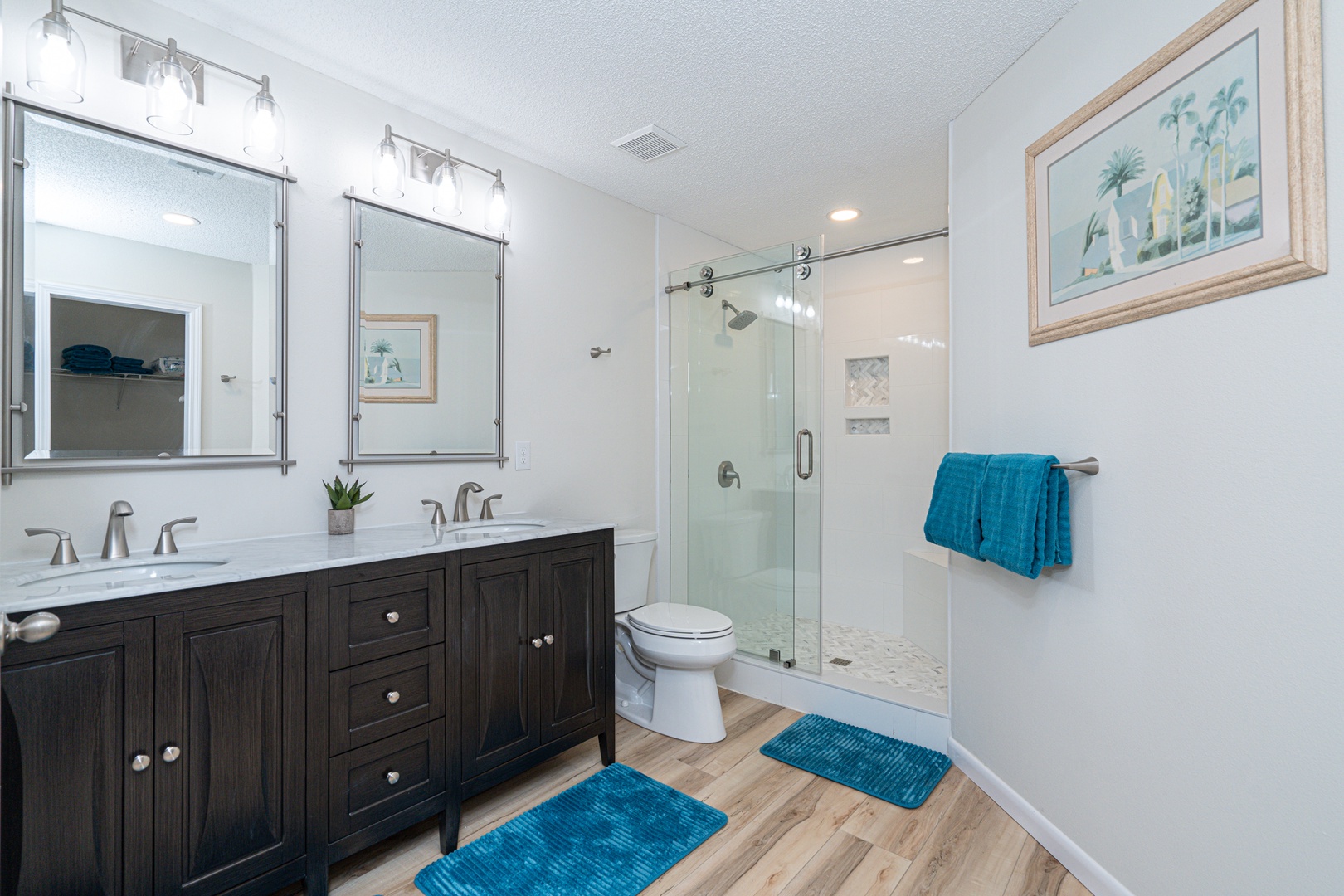 This spacious ensuite bath features a double vanity & glass shower