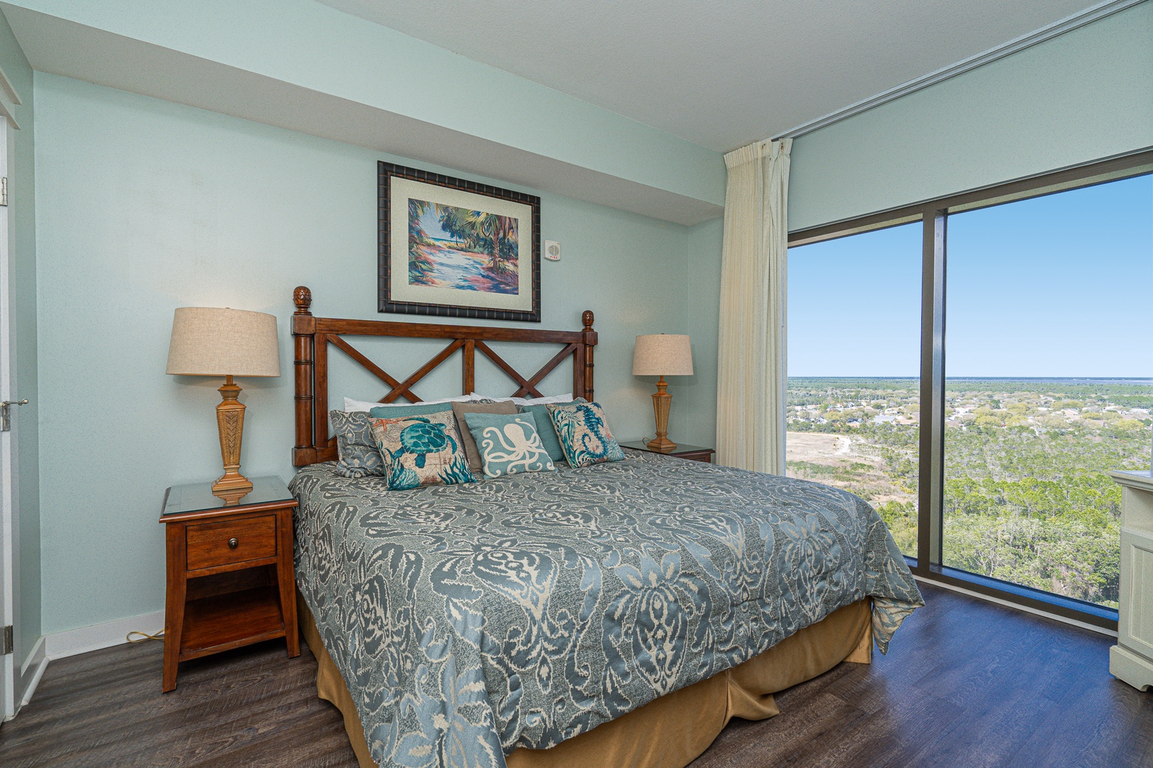 The 2nd bedroom retreat showcases a plush king bed, TV, & gorgeous views